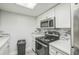 Updated kitchen featuring stainless steel appliances and modern backsplash at 936 Lake Destiny Rd # G, Altamonte Springs, FL 32714