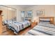 Inviting bedroom featuring two twin beds with striped bedding and a mirrored closet at 2727 N Poinciana Blvd # 134, Kissimmee, FL 34746