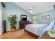 Tranquil bedroom featuring a ceiling fan, complemented by elegant decor and ample natural light at 2727 N Poinciana Blvd # 134, Kissimmee, FL 34746