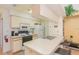 Functional kitchen with appliances and breakfast bar at 2727 N Poinciana Blvd # 134, Kissimmee, FL 34746