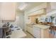 Fully-equipped kitchen offers a view into the dining and living areas at 2727 N Poinciana Blvd # 134, Kissimmee, FL 34746