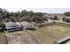 An aerial view showcases a serene backyard and spacious grassy area at 1027 Sheeler Hills Dr, Apopka, FL 32703