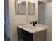 Modern bathroom with sleek vanity, new fixtures, and stylish mirrors at 1027 Sheeler Hills Dr, Apopka, FL 32703