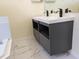 The bathroom features a modern double sink vanity and marble floors at 1027 Sheeler Hills Dr, Apopka, FL 32703