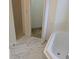 This bathroom features marble floors and a luxurious tub at 1027 Sheeler Hills Dr, Apopka, FL 32703