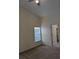 This bright bedroom features a large window and neutral carpeting for a comfortable feel at 1027 Sheeler Hills Dr, Apopka, FL 32703