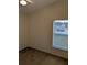 Cozy bedroom featuring a window offering outside views with carpeted floors at 1027 Sheeler Hills Dr, Apopka, FL 32703