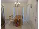 Dining area featuring a wooden table and a chandelier at 1027 Sheeler Hills Dr, Apopka, FL 32703