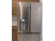 Close up of a modern, stainless steel refrigerator in the kitchen at 1027 Sheeler Hills Dr, Apopka, FL 32703