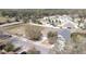 A street view showcases homes in a peaceful, tree-lined suburban neighborhood at 1027 Sheeler Hills Dr, Apopka, FL 32703