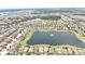 Beautiful aerial view overlooking the neighborhood lake with fountain at 10275 Henbury St, Orlando, FL 32832