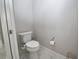 Clean and pristine bathroom with white marble floors, white walls, and a toilet with a bidet at 10275 Henbury St, Orlando, FL 32832