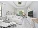 Bright bedroom features tray ceiling, white marble floors and access to the bathroom at 10275 Henbury St, Orlando, FL 32832