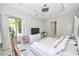 Well-lit bedroom with a hammock, patio access, and a functional workspace at 10275 Henbury St, Orlando, FL 32832