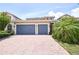 Beautiful home with a paved driveway and a convenient three-car garage at 10275 Henbury St, Orlando, FL 32832