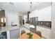 Bright kitchen featuring white cabinets, stainless steel appliances, and a breakfast nook with a window view at 10275 Henbury St, Orlando, FL 32832