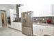 Well-lit kitchen with stainless steel appliances, sleek countertops, and ample cabinet space for storage, open design at 10275 Henbury St, Orlando, FL 32832