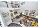 Open concept living room view from stairs showcases elegant design and abundant natural light at 10275 Henbury St, Orlando, FL 32832