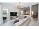 A modern living room with a large television, comfortable seating, and stylish decor at 10275 Henbury St, Orlando, FL 32832
