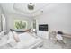 Bright main bedroom featuring a ceiling fan, and a hammock next to the natural light from windows at 10275 Henbury St, Orlando, FL 32832