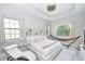 Bright main bedroom featuring a ceiling fan, and a hammock next to the natural light from windows at 10275 Henbury St, Orlando, FL 32832