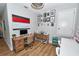 Bright office area with hardwood floors, two desks, and wall decorations at 10275 Henbury St, Orlando, FL 32832