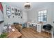 Office with a ceiling fan, two work stations, and pictures on the wall at 10275 Henbury St, Orlando, FL 32832