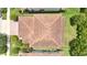 Birds eye view of the clay tiled roof and greenery surrounding this beautiful home at 10275 Henbury St, Orlando, FL 32832