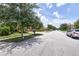 Street view of a suburban neighborhood with landscaped lawns and sidewalks at 10275 Henbury St, Orlando, FL 32832