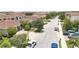 Street view showcasing a residential neighborhood with well-maintained lawns and houses with red tile roofs at 10275 Henbury St, Orlando, FL 32832