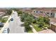Street view of homes with red tile roofs, lush trees, and sidewalks at 10275 Henbury St, Orlando, FL 32832