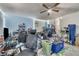 Unfinished basement with ceiling fan, chair, blue block wall, and other items at 10359 Smyrna Dr, Orlando, FL 32817