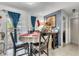 Inviting dining room featuring blue curtains, white tablecloth and tile floors at 10359 Smyrna Dr, Orlando, FL 32817