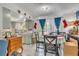 Cozy dining area with tile flooring, table with chairs, and lots of natural light at 10359 Smyrna Dr, Orlando, FL 32817