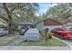 Charming single-Gathering home featuring stone accents and a well-maintained front yard at 10359 Smyrna Dr, Orlando, FL 32817