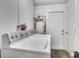 Laundry room with a white washer and dryer set and access to the backyard at 10359 Smyrna Dr, Orlando, FL 32817