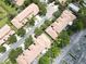 An aerial view of neighborhood with beautiful houses and mature trees at 10423 Belfry Cir, Orlando, FL 32832