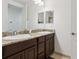 Bathroom featuring a double sink vanity with granite countertop and plenty of room at 10423 Belfry Cir, Orlando, FL 32832