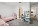 Cozy bedroom with twin beds, desk, and connected bathroom providing space for relaxation and productivity at 10423 Belfry Cir, Orlando, FL 32832