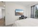 Bedroom with a television, keyboard, and view of nature offering a tranquil atmosphere at 10423 Belfry Cir, Orlando, FL 32832