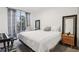 Bright bedroom featuring a queen bed, sliding glass doors, and neutral tones for a peaceful ambiance at 10423 Belfry Cir, Orlando, FL 32832