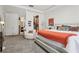 Spacious primary bedroom with a sitting area, a walk-in closet, and an en-suite bathroom at 10423 Belfry Cir, Orlando, FL 32832