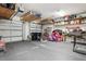 Spacious garage with overhead storage, workbench and organization, offering ample storage at 10423 Belfry Cir, Orlando, FL 32832