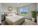 Serene bedroom with a plush bed, natural light, and stylish decor at 1192 Alstonia Ln, Mount Dora, FL 32757