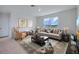 Inviting living room with comfortable seating, a window view, and decorative artwork at 1192 Alstonia Ln, Mount Dora, FL 32757