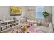 Cheerful playroom with a cozy couch, modern furniture, and playful decor at 1192 Alstonia Ln, Mount Dora, FL 32757