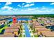 Aerial view showcasing a well-planned residential community with neat streets and manicured lawns at 1512 Mumbai Way, Kissimmee, FL 34747