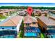 Aerial shot of a backyard pool and screened-in lanai in a residential neighborhood at 1512 Mumbai Way, Kissimmee, FL 34747