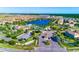Stunning aerial shot of the community with a central lake, lush greenery, and well-planned infrastructure at 1512 Mumbai Way, Kissimmee, FL 34747