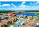 Aerial view of a residential community featuring a central lake and well-maintained landscaping at 1512 Mumbai Way, Kissimmee, FL 34747